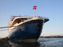 The flag of the Bahamas flies proudly off the stern.